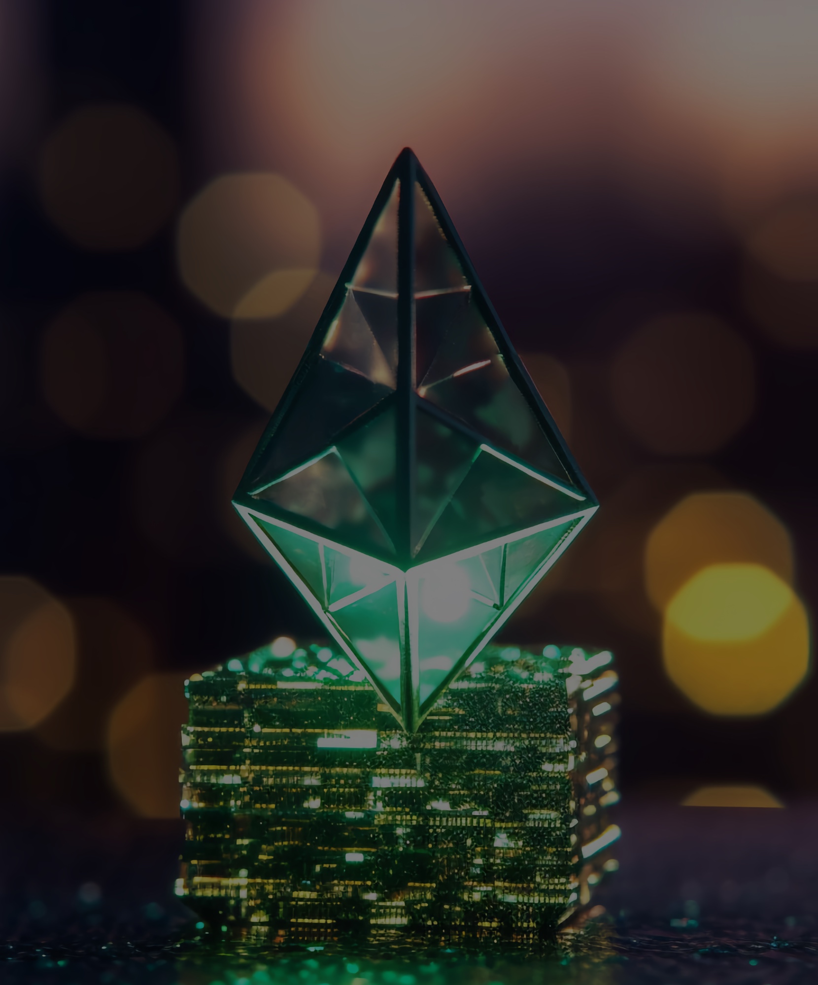 Image of the Ethereum Logo as a green translucent emerald on a computer chip blockchain